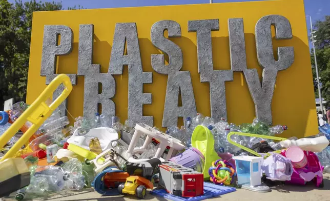 Plastic items are seen on Place des Nations in front of the European headquarters of the United Nations in Geneva, Switzerland, Monday, Aug. 4, 2025 before the second segment of the fifth session of the Intergovernmental Negotiating Committee on Plastic Pollution (INC-5.2). (Salvatore Di Nolfi/Keystone via AP)