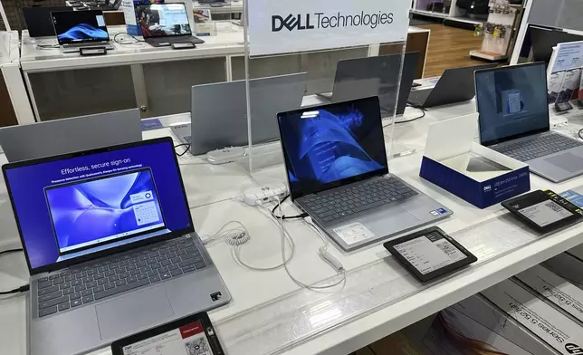 Laptop computers are displayed at a retail store in Vernon Hills, Ill., Thursday, Aug. 7, 2025. (AP Photo/Nam Y. Huh)