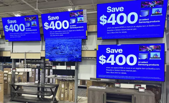 Flat screen TVs are displayed at a retail store in Vernon Hills, Ill., Thursday, Aug. 7, 2025. (AP Photo/Nam Y. Huh)