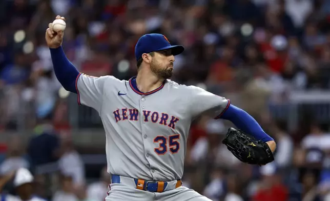New York Mets pitcher Clay Holmes throws during the first inning of a baseball game against the Atlanta Braves, Saturday, Aug. 23, 2025, in Atlanta. (AP Photo/Butch Dill)