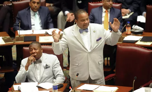 FILE - Sen. Jesse Hamilton, D-Brooklyn, right, stands in the Senate Chamber at the Capitol, June 17, 2016, in Albany, N.Y. (AP Photo/Hans Pennink, File)