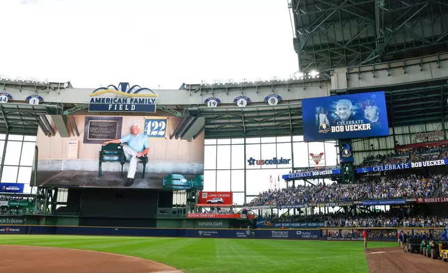 Photos of Bob Uecker are shown on a scoreboard during the Bob Uecker Celebration of Life ceremony before a baseball game between the San Francisco Giants and the Milwaukee Brewers, Sunday, Aug. 24, 2025, in Milwaukee. (AP Photo/Jeffrey Phelps)