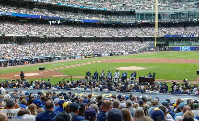 Fans attend the Bob Uecker Celebration of Life ceremony before a baseball game between the San Francisco Giants and the Milwaukee Brewers, Sunday, Aug. 24, 2025, in Milwaukee. (AP Photo/Jeffrey Phelps)