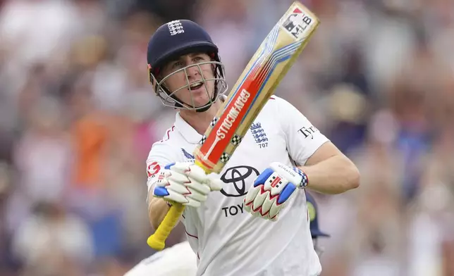 England's Harry Brook celebrates after scoring a century on day four of the fifth cricket test match between England and India at The Kia Oval in London, Sunday, Aug. 3, 2025. (AP Photo/Kirsty Wigglesworth)
