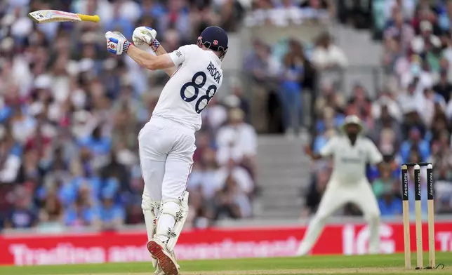 England's Harry Brook loose his bat while playing a shot on day four of the fifth cricket test match between England and India at The Kia Oval in London, Sunday, Aug. 3, 2025. (AP Photo/Kirsty Wigglesworth)