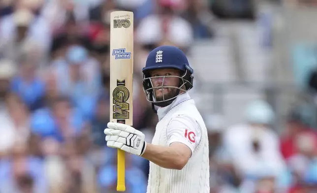 England's Ben Duckett celebrates after scoring fifty runs on day four of the fifth cricket test match between England and India at The Kia Oval in London, Sunday, Aug. 3, 2025. (AP Photo/Kirsty Wigglesworth)