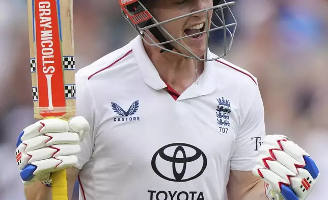 England's Harry Brook celebrates after scoring a century on day four of the fifth cricket test match between England and India at The Kia Oval in London, Sunday, Aug. 3, 2025. (AP Photo/Kirsty Wigglesworth)