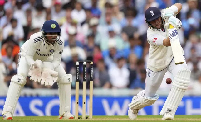England's Joe Root, right, plays a shot on day four of the fifth cricket test match between England and India at The Kia Oval in London, Sunday, Aug. 3, 2025. (AP Photo/Kirsty Wigglesworth)