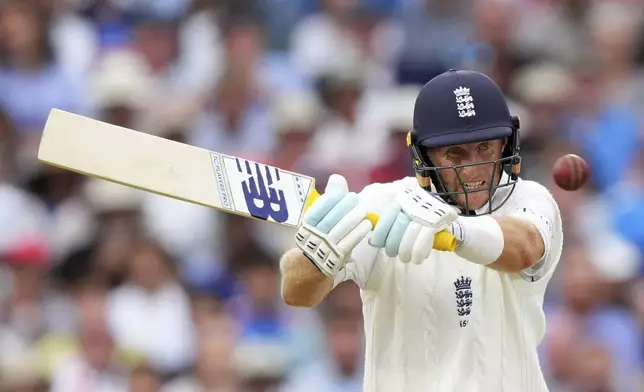 England's Joe Root plays a shot on day four of the fifth cricket test match between England and India at The Kia Oval in London, Sunday, Aug. 3, 2025. (AP Photo/Kirsty Wigglesworth)