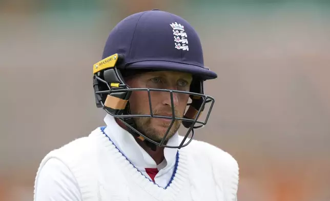 England's Joe Root walks off the field after losing his wicket on day four of the fifth cricket test match between England and India at The Kia Oval in London, Sunday, Aug. 3, 2025. (AP Photo/Kirsty Wigglesworth)