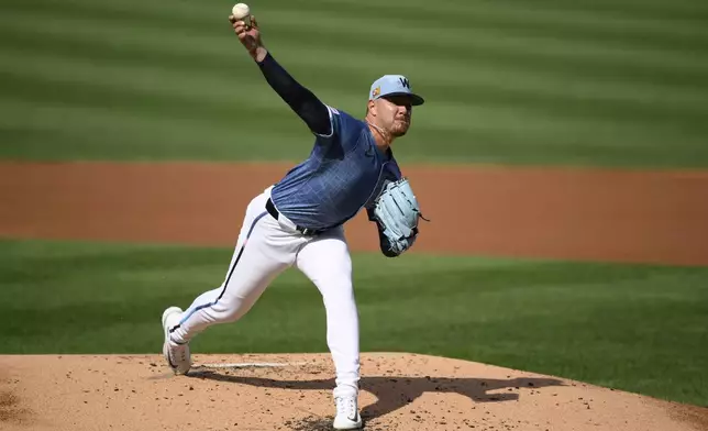 Washington Nationals starting pitcher Cade Cavalli throws during the second inning of a baseball game against the Philadelphia Phillies, Saturday, Aug. 16, 2025, in Washington. (AP Photo/Nick Wass)