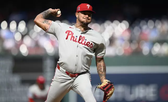 Philadelphia Phillies starting pitcher Taijuan Walker (99) throws during the first inning of a baseball game against the Washington Nationals, Saturday, Aug. 16, 2025, in Washington. (AP Photo/Nick Wass)