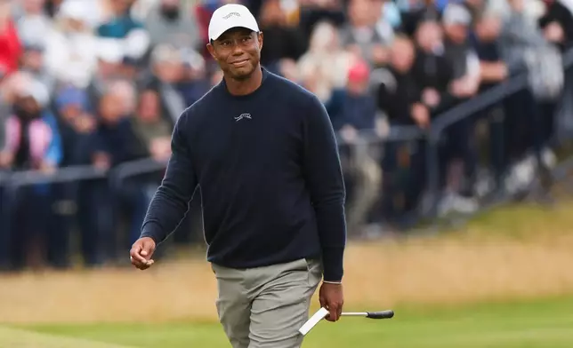 FILE - Tiger Woods of the United States walks to the 18th green during his second round of the British Open Golf Championships at Royal Troon golf club in Troon, Scotland, Friday, July 19, 2024. (AP Photo/Scott Heppell, File)