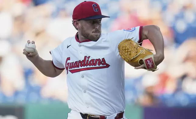 Cleveland Guardians' Tanner Bibee pitches in the first inning of a baseball game against the Miami Marlins in Cleveland, Thursday, Aug. 14, 2025. (AP Photo/Sue Ogrocki)