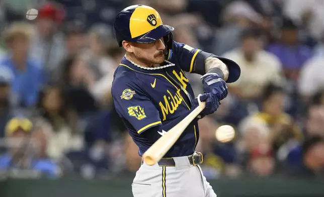 Milwaukee Brewers' Joey Ortiz singles during the fifth inning of a baseball game against the Washington Nationals, Friday, Aug. 1, 2025, in Washington. (AP Photo/Nick Wass)