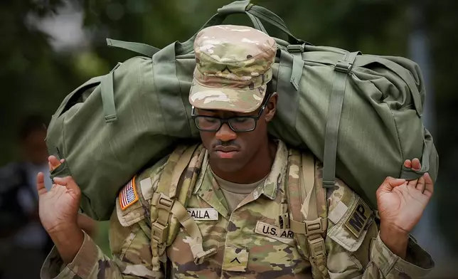 A member of the District of Columbia National Guard arrives at the District of Columbia National Guard Headquarters, Tuesday, Aug. 12, 2025, in Washington. (AP Photo/Julia Demaree Nikhinson)
