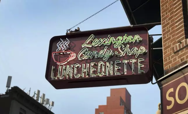 A sign for the Lexington Avenue Candy Shop Luncheonette appears in New York on Aug. 7, 2025. (AP Photo/Guido Neira)