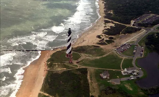 FILE - The Cape Hatteras lighthouse stands, Aug. 29, 1995 on the Outer Banks of North Carolina. (AP Photo/Ruth Fremson, File)