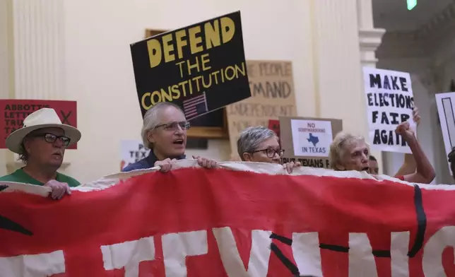 Protesters gather in the rotunda outside the House Chamber at the Texas Capitol as lawmakers debate a redrawn U.S. congressional map in Texas during a special session, Wednesday, Aug. 20, 2025, in Austin, Texas. (AP Photo/Eric Gay)