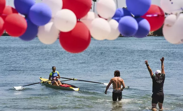 Athletes train at a beach sprints camp organized by USRowing in Long Beach, Calif., Sunday, Aug. 10, 2025. (AP Photo/Damian Dovarganes)