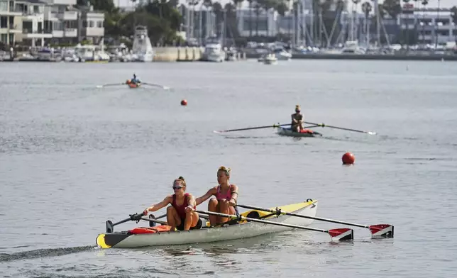 Athletes train at a beach sprints camp organized by USRowing in Long Beach, Calif., Sunday, Aug. 10, 2025. (AP Photo/Damian Dovarganes)