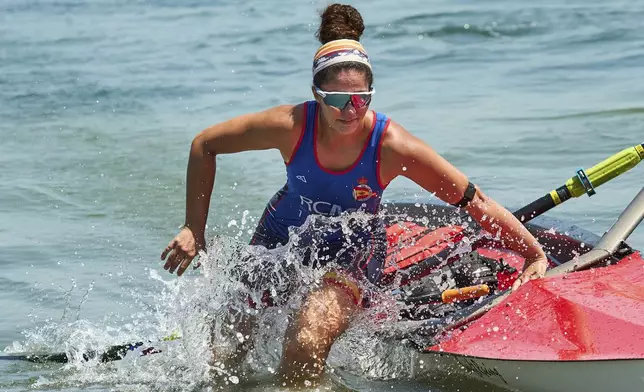 An athlete trains at a beach sprints camp organized by USRowing in Long Beach, Calif., Sunday, Aug. 10, 2025. (AP Photo/Damian Dovarganes)
