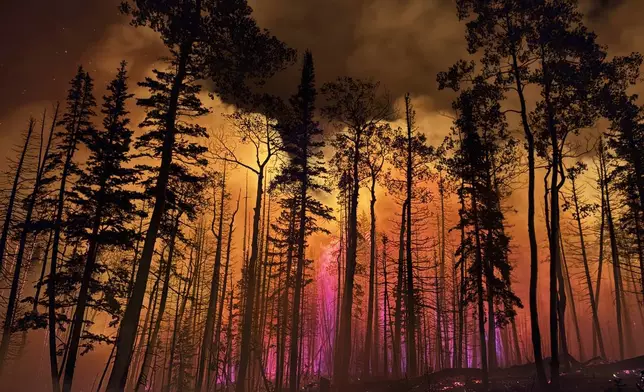 In this photo provided by the Hurricane Valley Fire District, the Monroe Canyon Fire blazes near Monroe, Utah, July 16, 2025. (Hurricane Valley Fire District via AP)