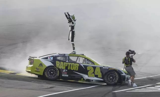 William Byron celebrates after winning a NASCAR Cup Series auto race, Sunday, Aug. 3, 2025, at Iowa Speedway in Newton, Iowa. (AP Photo/Bryon Houlgrave)