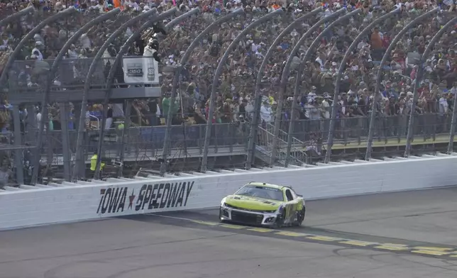 William Byron celebrates after winning a NASCAR Cup Series auto race, Sunday, Aug. 3, 2025, at Iowa Speedway in Newton, Iowa. (AP Photo/Bryon Houlgrave)