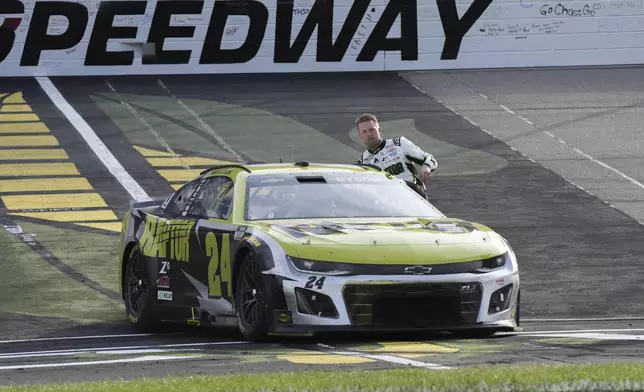 William Byron celebrates after winning a NASCAR Cup Series auto race, Sunday, Aug. 3, 2025, at Iowa Speedway in Newton, Iowa. (AP Photo/Bryon Houlgrave)