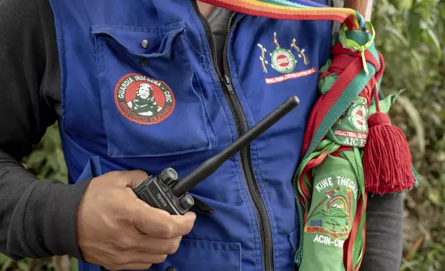 Eduwin Calambas Fernandez, coordinator of Kiwe Thegnas, which refers to Indigenous Guard in the Nasa Yuwe language, in Canoas, an Indigenous reserve in northern Cauca, Colombia, poses for a photo on July 15, 2025. (AP Photo/Nadège Mazars)