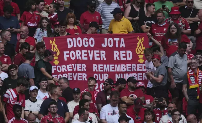 Liverpool fans hold a banner in the memory of Diogo Jota before the FA Community Shield final soccer match between Liverpool and Crystal Palace at Wembley Stadium in London,Sunday, Aug. 10, 2025. (AP Photo/Dave Shopland)