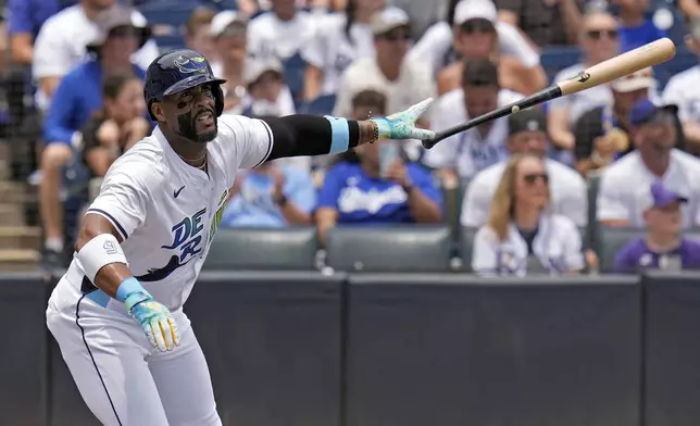 Tampa Bay Rays' Yandy Díaz drops his bat as he watches his solo home run off Los Angeles Dodgers pitcher Blake Snell during the first inning of a baseball game Saturday, Aug. 2, 2025, in Tampa, Fla. (AP Photo/Chris O'Meara)