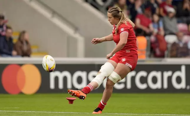 Canada's Sophie de Goede concerts her own try during the Women's Rugby World Cup 2025 Pool B match between Canada and Fiji at the York Community Stadium in York, England, Saturday, Aug. 23, 2025. (Danny Lawson/PA via AP)