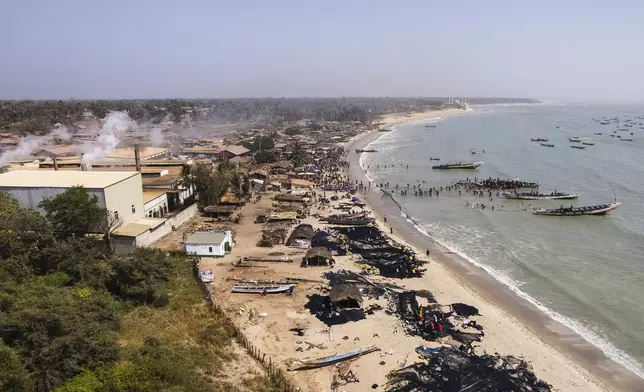 Artisanal fishermen on the shore of Gunjur, Gambia, on March 23, 2025. (AP Photo/Grace Ekpu)