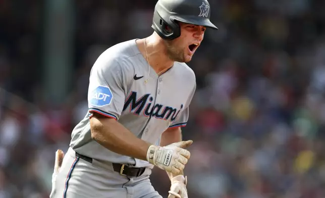 Miami Marlins' Jakob Marsee reacts after hitting a two-run home run in the ninth inning of a baseball game against the Boston Red Sox, Sunday, Aug. 17, 2025, in Boston. (AP Photo/Jim Davis)