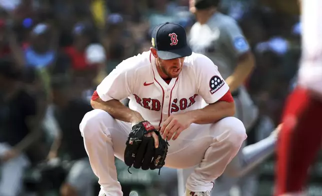 Boston Red Sox pitcher Steven Matz reacts after giving up a two-run home run in the ninth inning of a baseball game against the Miami Marlins, Sunday, Aug. 17, 2025, in Boston. (AP Photo/Jim Davis)
