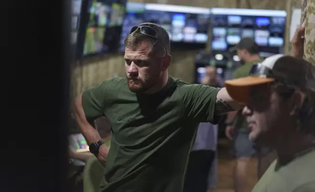 Serhii Filimonov, commander of the Da Vinci Wolves Battalion looks on a live stream from the frontline during fighting with Russian on Pokrovsk direction, Ukraine, Saturday, Aug. 9, 2025. (AP Photo/Evgeniy Maloletka)