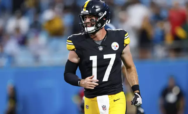 Pittsburgh Steelers quarterback Skylar Thompson celebrates after showing a touchdown pass against the Carolina Panthers during the first half of an NFL preseason football game, Thursday, Aug. 21, 2025, in Charlotte, N.C. (AP Photo/Rusty Jones)