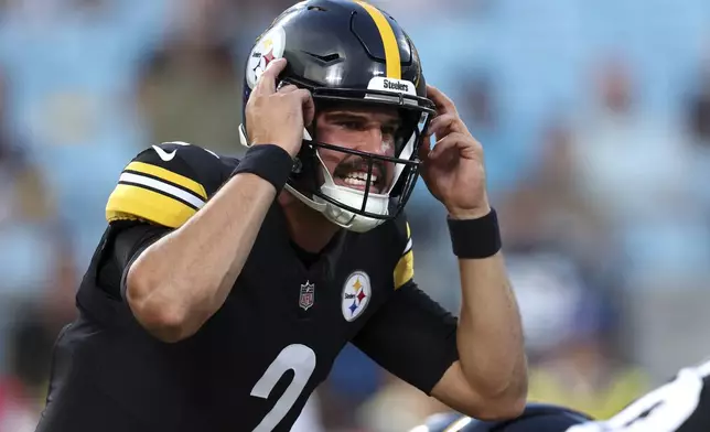 Pittsburgh Steelers quarterback Mason Rudolph plays against the Carolina Panthers during the first half of an NFL preseason football game, Thursday, Aug. 21, 2025, in Charlotte, N.C. (AP Photo/Scott Kinser)