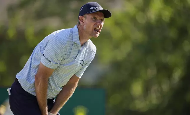 Justin Rose, of England, reacts to his tee shot on the 18th hole during the third round of the St. Jude Championship golf tournament Saturday, Aug. 9, 2025, in Memphis, Tenn. (AP Photo/George Walker IV)