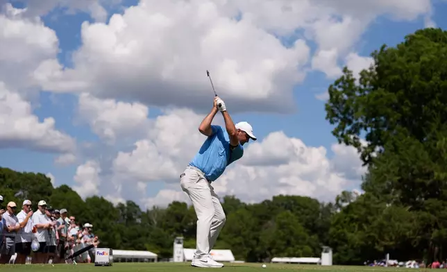 Scottie Scheffler hits from the 14th tee during the third round of the St. Jude Championship golf tournament Saturday, Aug. 9, 2025, in Memphis, Tenn. (AP Photo/George Walker IV)