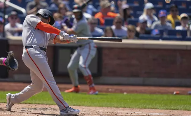 San Francisco Giants' Rafael Devers hits a three-run homer during the third inning of a baseball game against the New York Mets, Sunday, Aug. 3, 2025, in New York. (AP Photo/Seth Wenig)