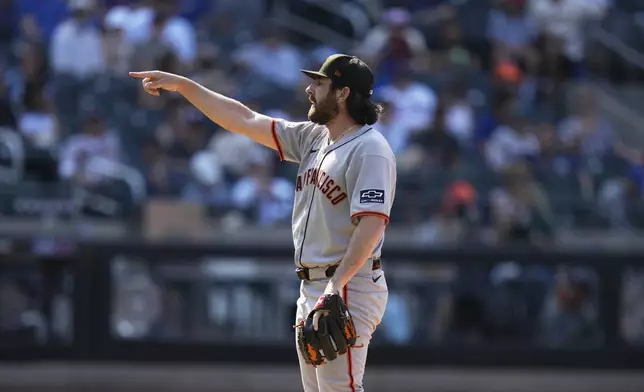San Francisco Giants pitcher Ryan Walker reacts during the ninth inning of a baseball game against the New York Mets, Sunday, Aug. 3, 2025, in New York. (AP Photo/Seth Wenig)