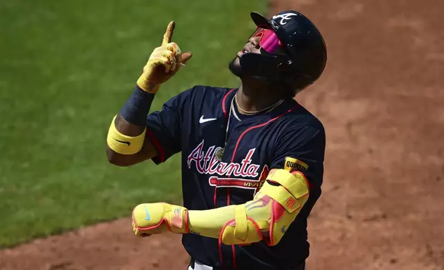 Atlanta Braves' Ronald Acuna Jr. celebrates after hitting a single during the third inning of a baseball game against the Cleveland Guardians, Sunday, Aug. 17, 2025, in Cleveland. (AP Photo/David Dermer)