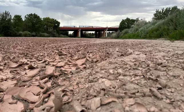 Traffic crosses a bridge over the dry Rio Grande along Interstate 40 in Albuquerque, N.M., on Thursday, Aug. 21, 2025. (AP Photo/Susan Montoya Bryan)