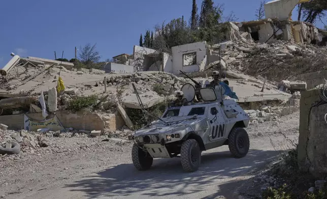 French U.N. peacekeepers patrol the Lebanese-Israeli border in the village of Kfra Kila, southern Lebanon, Wednesday, Aug. 20, 2025. (AP Photo/Hussein Malla)