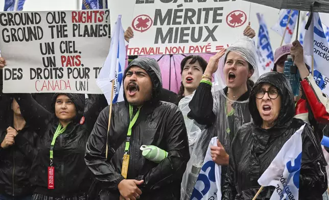 Air Canada employees and union members protest outside the Air Canada headquarters in Montreal, Sunday, Aug. 17, 2025, after the federal government intervened in the labour dispute between the airline and the union representing its flight attendants, ordering binding arbitration and operations to resume. (Graham Hughes/The Canadian Press via AP)