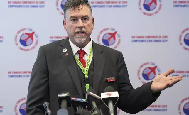 Wesley Lesosky, president of the Air Canada component of CUPE speaks during a press conference regarding a possible flight attendant strike in Toronto on Thursday, Aug. 14, 2025. (Nathan Denette/The Canadian Press via AP)