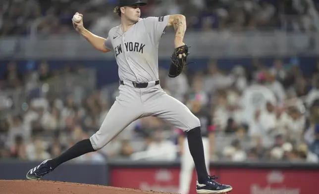 New York Yankees pitcher Cam Schlittler throws against the Miami Marlins during the first inning of a baseball game, Saturday, Aug. 2, 2025, in Miami. (AP Photo/Jim Rassol)